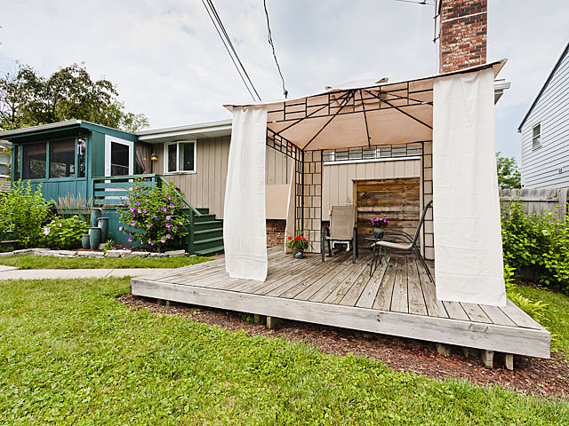 869 Spring Road Elmhurst, IL 60126 - Photo 20 of 25 a view of a house with wooden deck and furniture