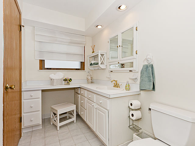 869 Spring Road Elmhurst, IL 60126 - Photo 9 of 25 a kitchen with a sink cabinets and wooden floor