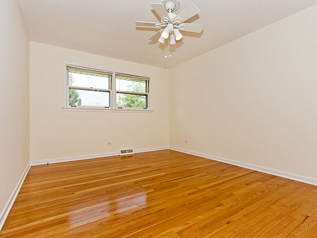 869 Spring Road Elmhurst, IL 60126 - Photo 10 of 25 a view of an empty room with a window