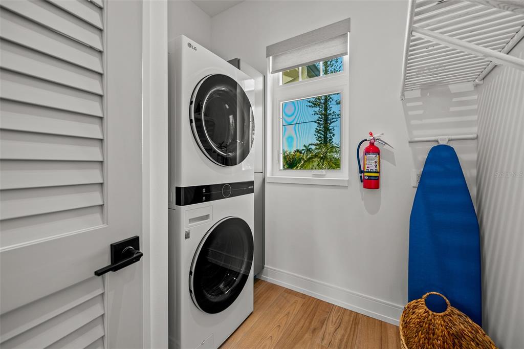401 77th Street Holmes Beach, FL 34217 - Photo 22 of 92 a utility room with dryer and washer