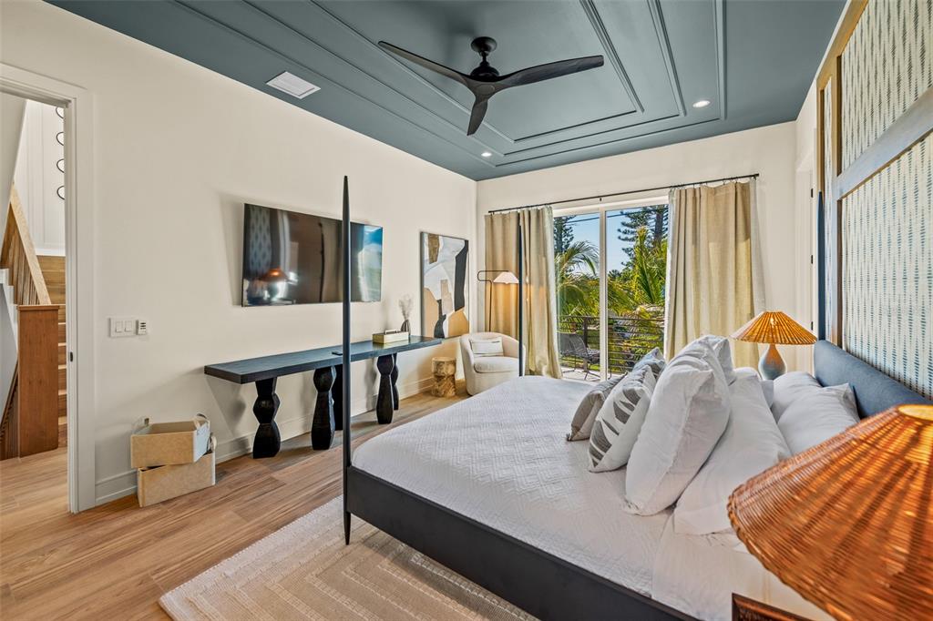 401 77th Street Holmes Beach, FL 34217 - Photo 24 of 92 a view of a livingroom with furniture window and wooden floor