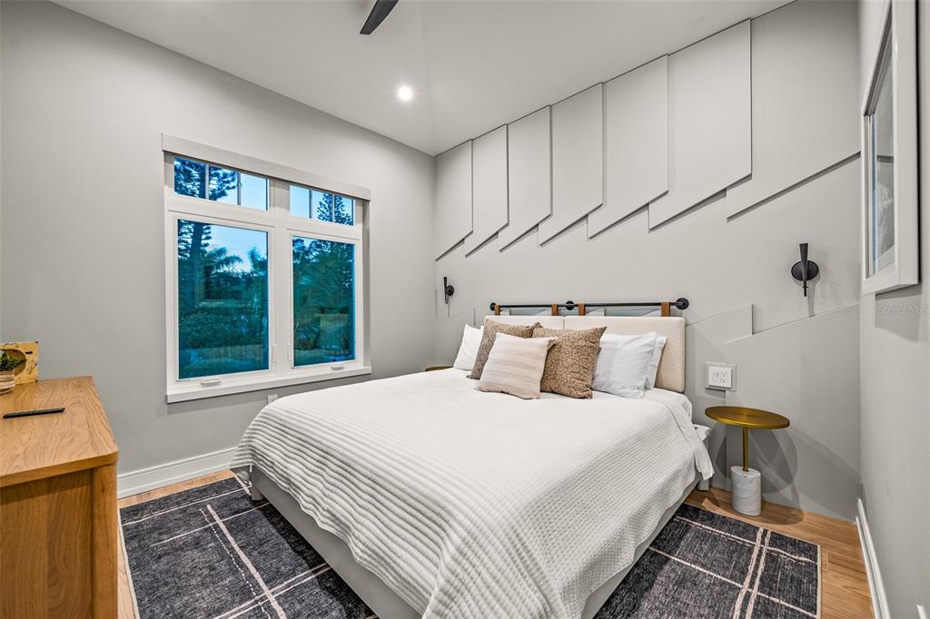 401 77th Street Holmes Beach, FL 34217 - Photo 42 of 92 a bedroom with a bed and a window