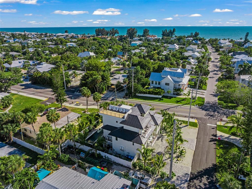 401 77th Street Holmes Beach, FL 34217 - Photo 79 of 92 an aerial view of a house with a garden and outdoor space