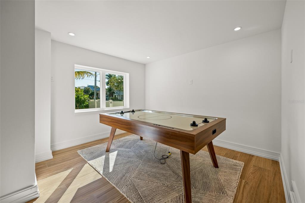 401 77th Street Holmes Beach, FL 34217 - Photo 8 of 92 a room with a window and a table