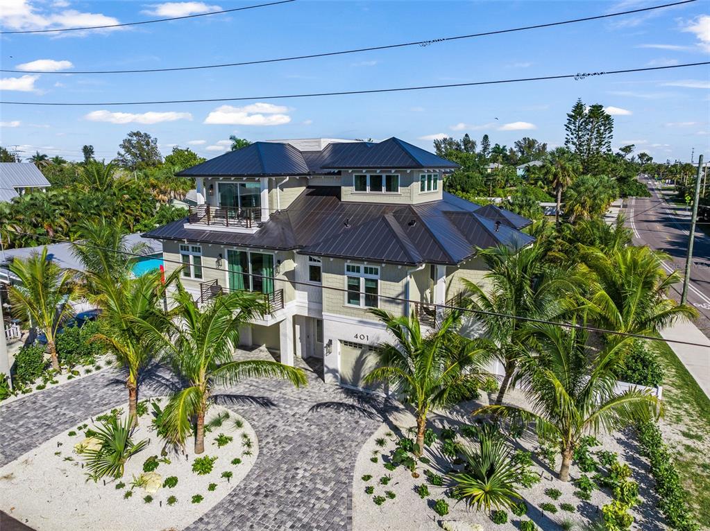 401 77th Street Holmes Beach, FL 34217 - Photo 82 of 92 a view of a chairs in a patio