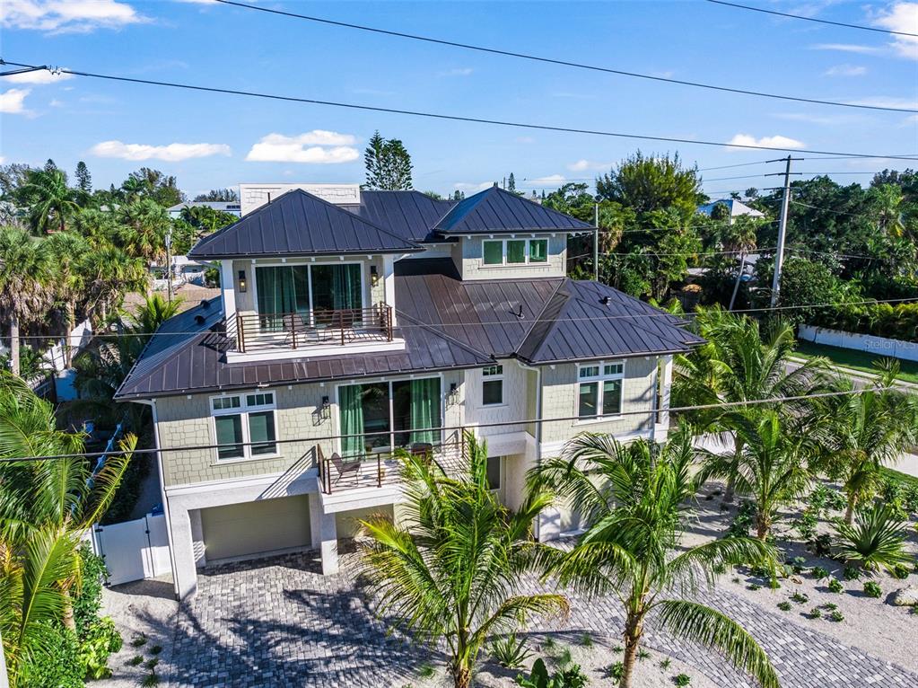 401 77th Street Holmes Beach, FL 34217 - Photo 85 of 92 a front view of a house with a yard