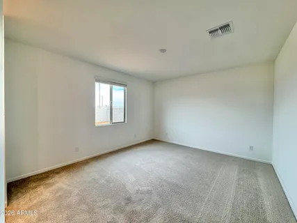 a view of a swimming pool with a lounge chairs