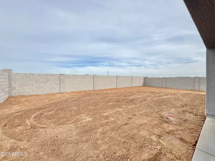 a view of a swimming pool with an outdoor seating