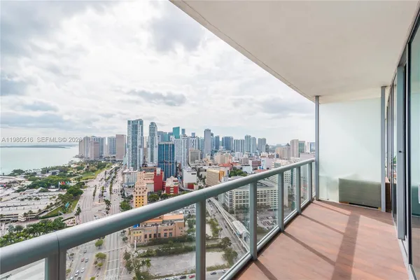 a view of a city skyline from a balcony