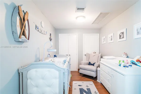 a bedroom with a bed and a couch