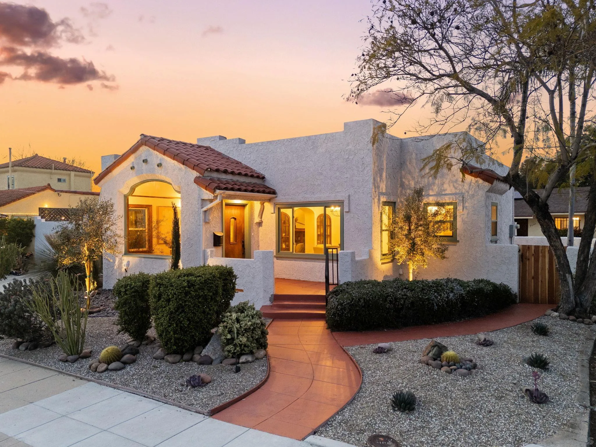 4052 Alder Drive San Diego, CA 92116 - Photo 1 of 28 a front view of a house with a yard