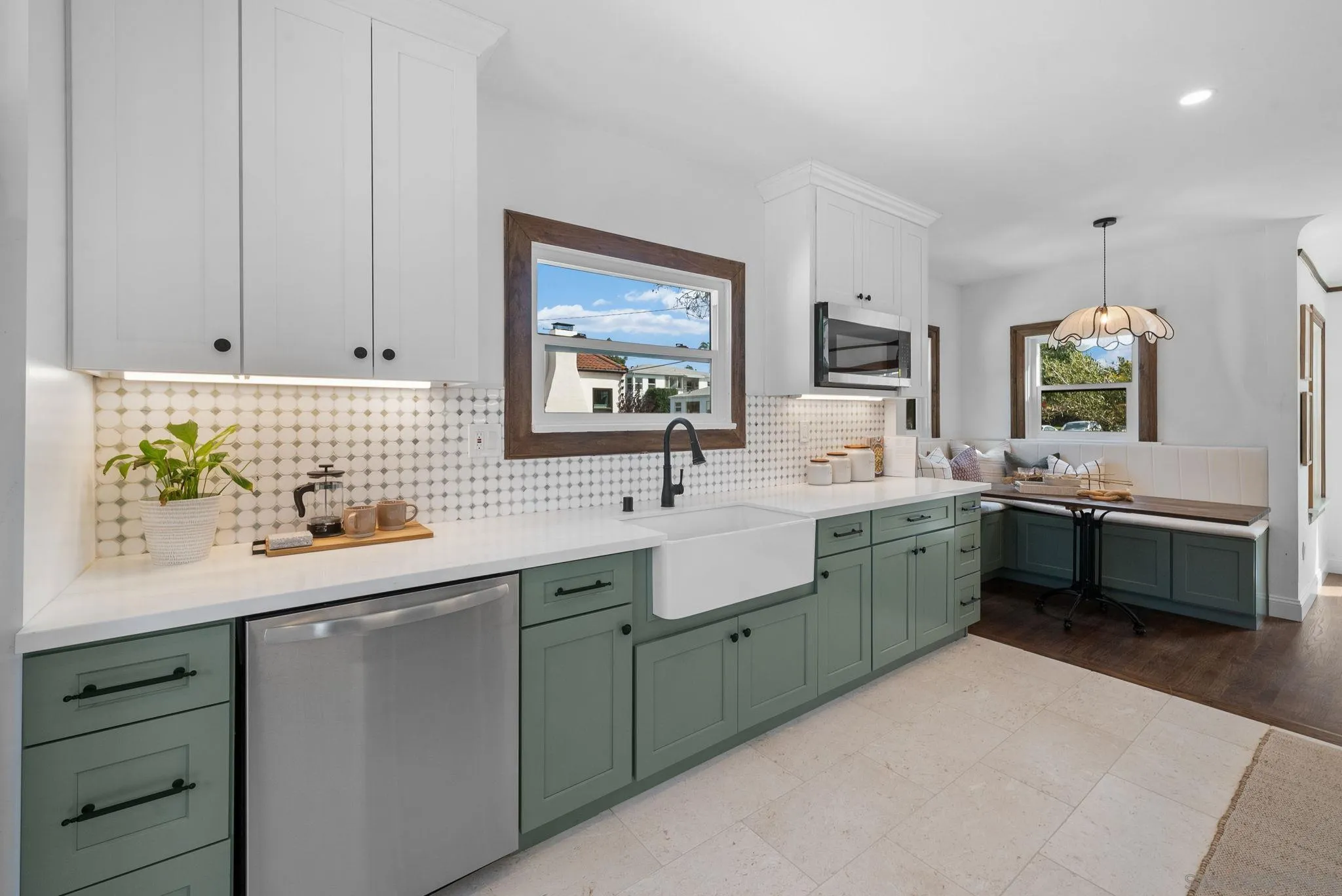 4052 Alder Drive San Diego, CA 92116 - Photo 14 of 28 a kitchen with a sink and cabinets