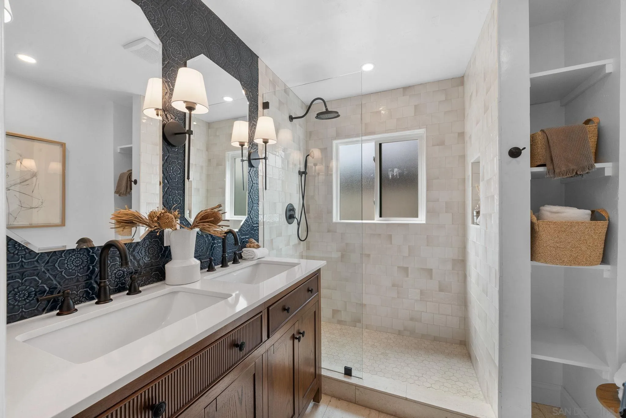 4052 Alder Drive San Diego, CA 92116 - Photo 17 of 28 a bathroom with a double vanity sink mirror and shower