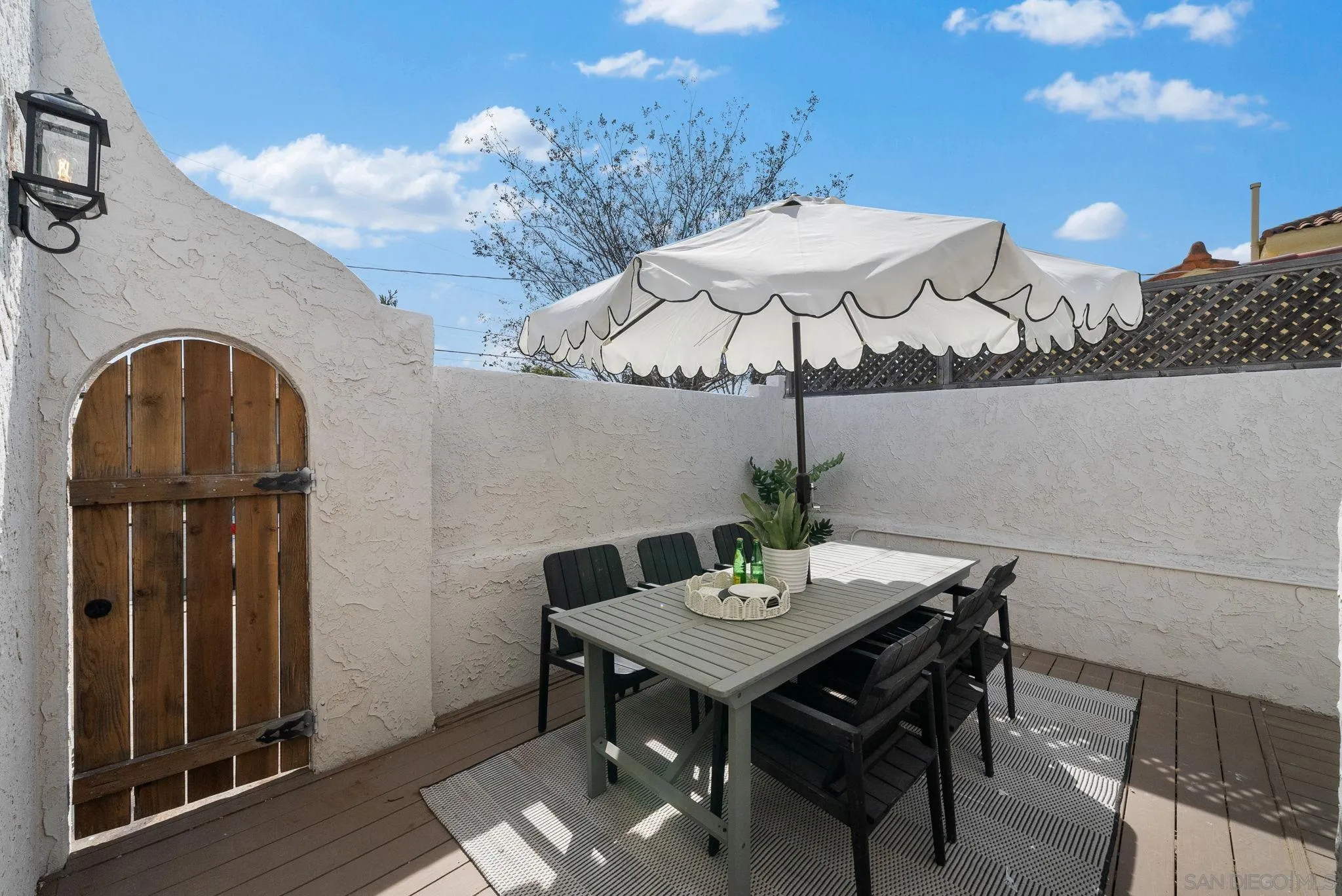 4052 Alder Drive San Diego, CA 92116 - Photo 23 of 28 a view of a table and chairs in patio