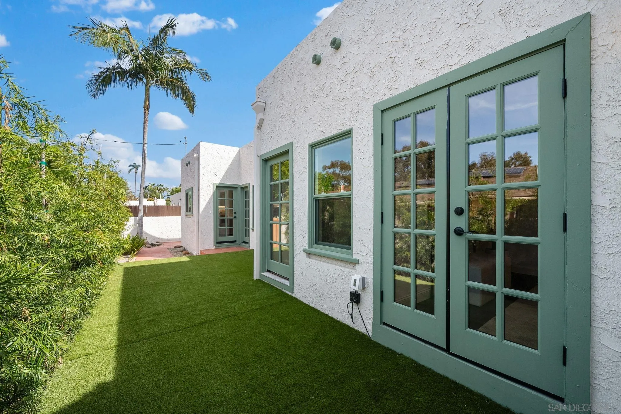 4052 Alder Drive San Diego, CA 92116 - Photo 25 of 28 a view of a house with a yard and porch