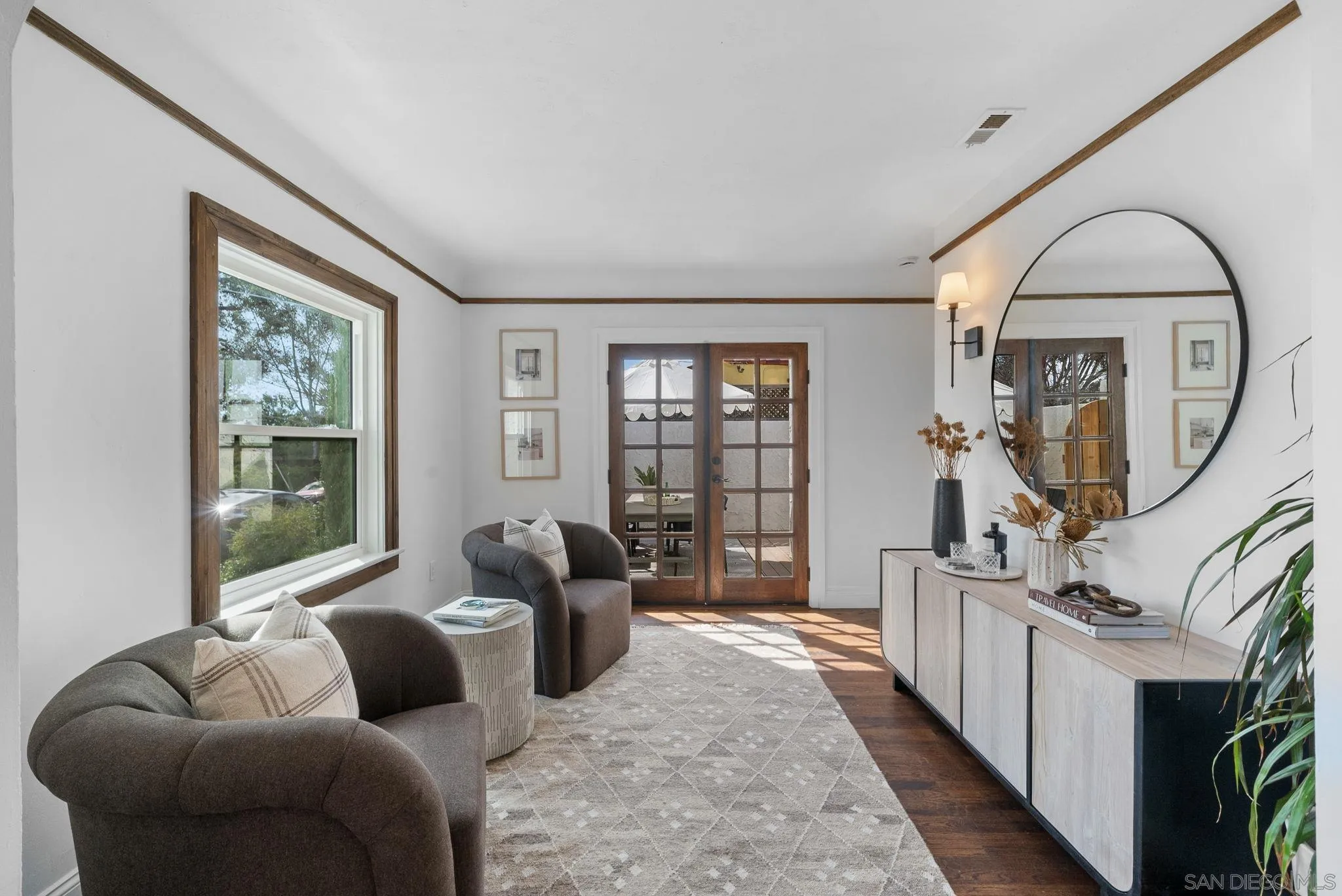 4052 Alder Drive San Diego, CA 92116 - Photo 7 of 28 a living room with furniture fireplace and a large window