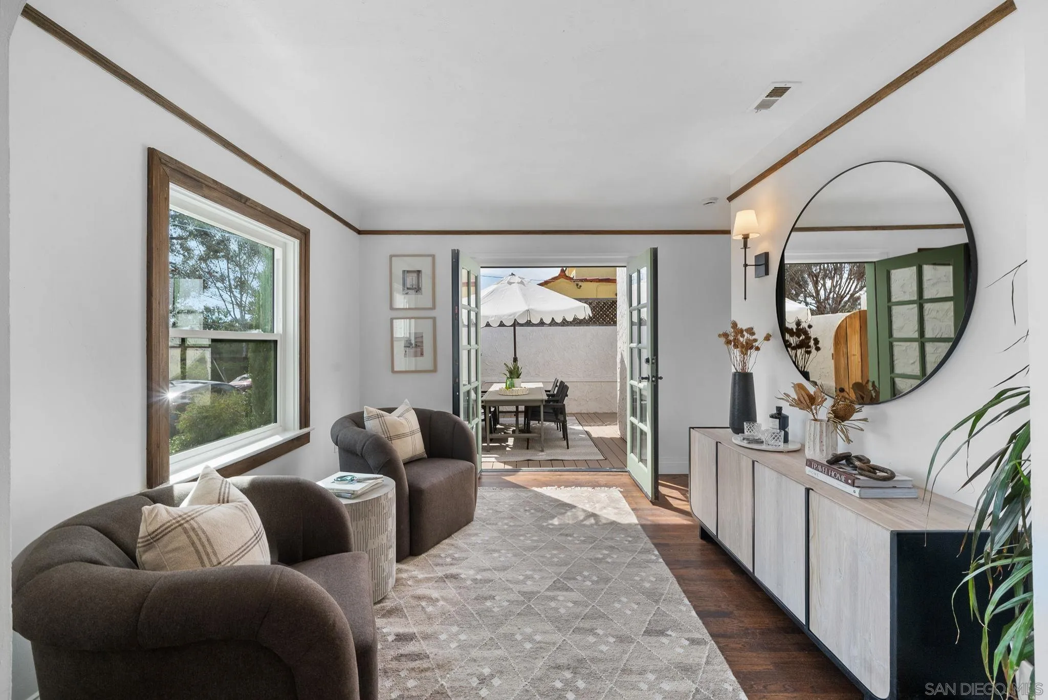 4052 Alder Drive San Diego, CA 92116 - Photo 8 of 28 a living room with furniture fireplace and a large window