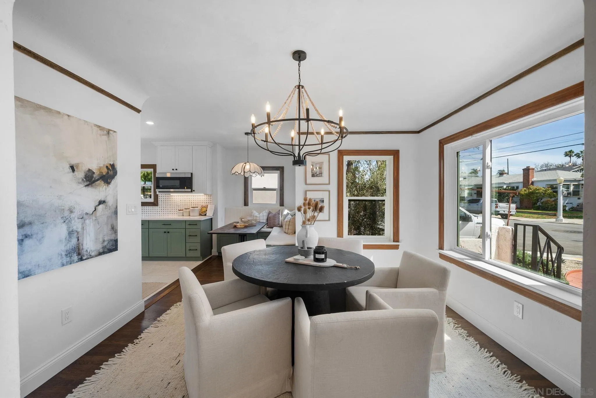 4052 Alder Drive San Diego, CA 92116 - Photo 9 of 28 a view of a dining room with furniture wooden floor and a chandelier