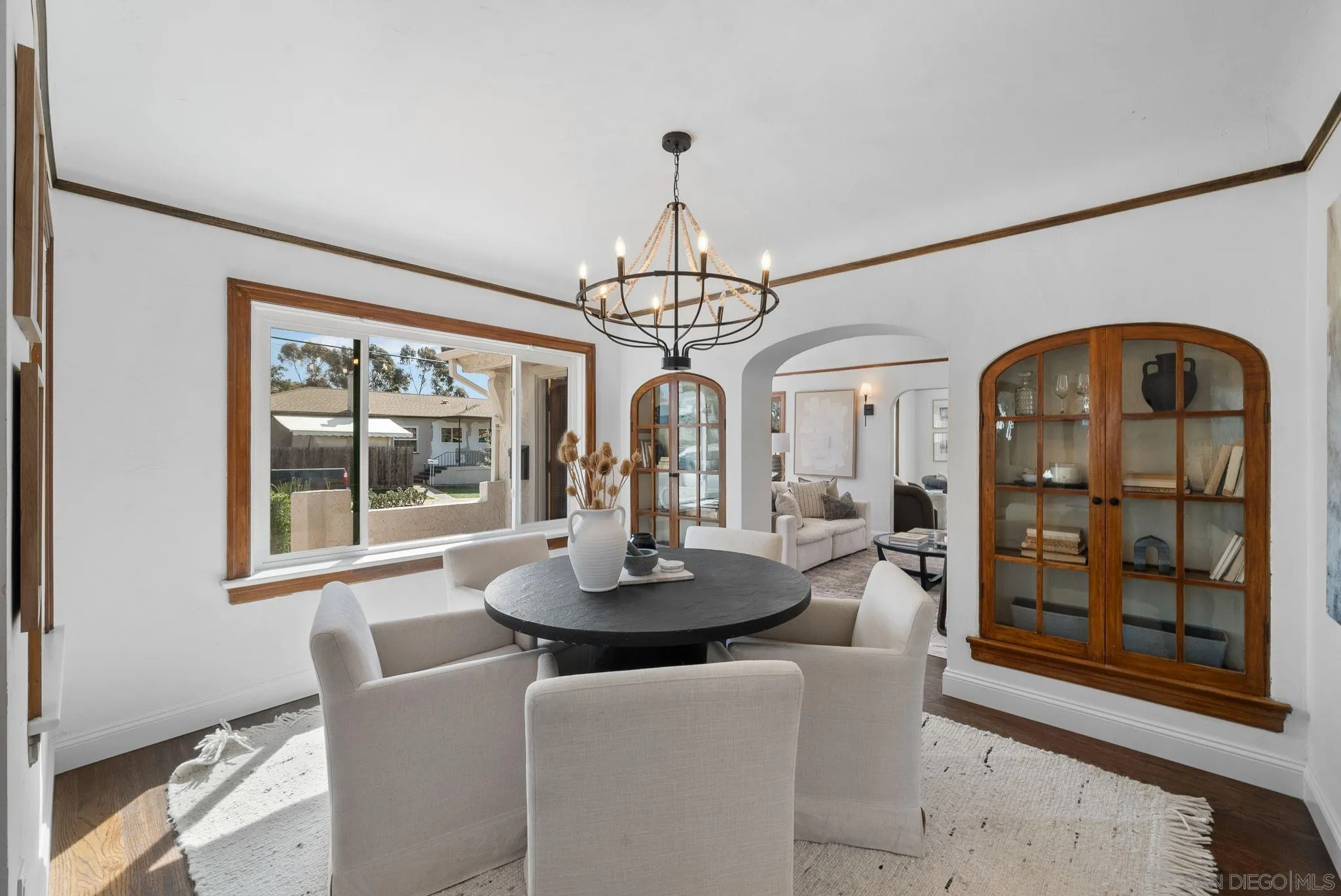 4052 Alder Drive San Diego, CA 92116 - Photo 10 of 28 a dining room with furniture a chandelier and window