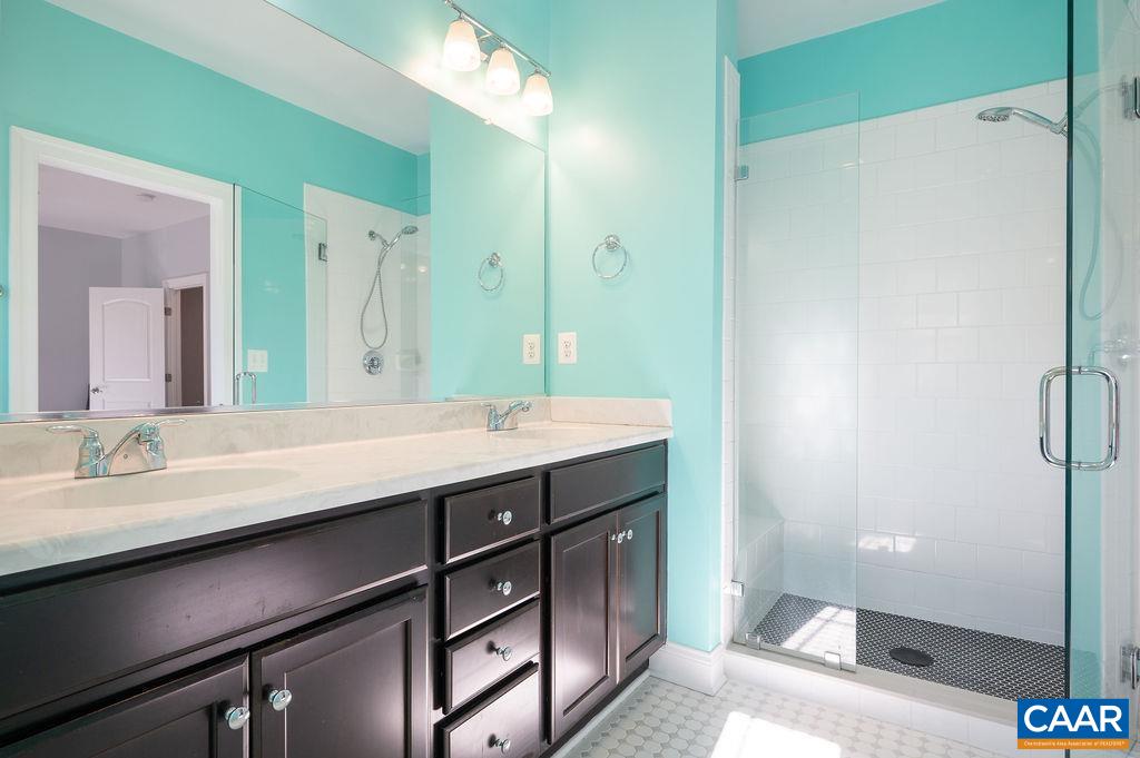 2146 Avinity Loop Charlottesville, VA 22902 - Photo 12 of 27 a bathroom with a sink and a mirror