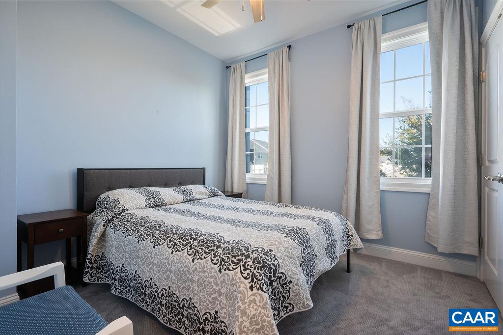 2146 Avinity Loop Charlottesville, VA 22902 - Photo 14 of 27 a bedroom with a bed and a window