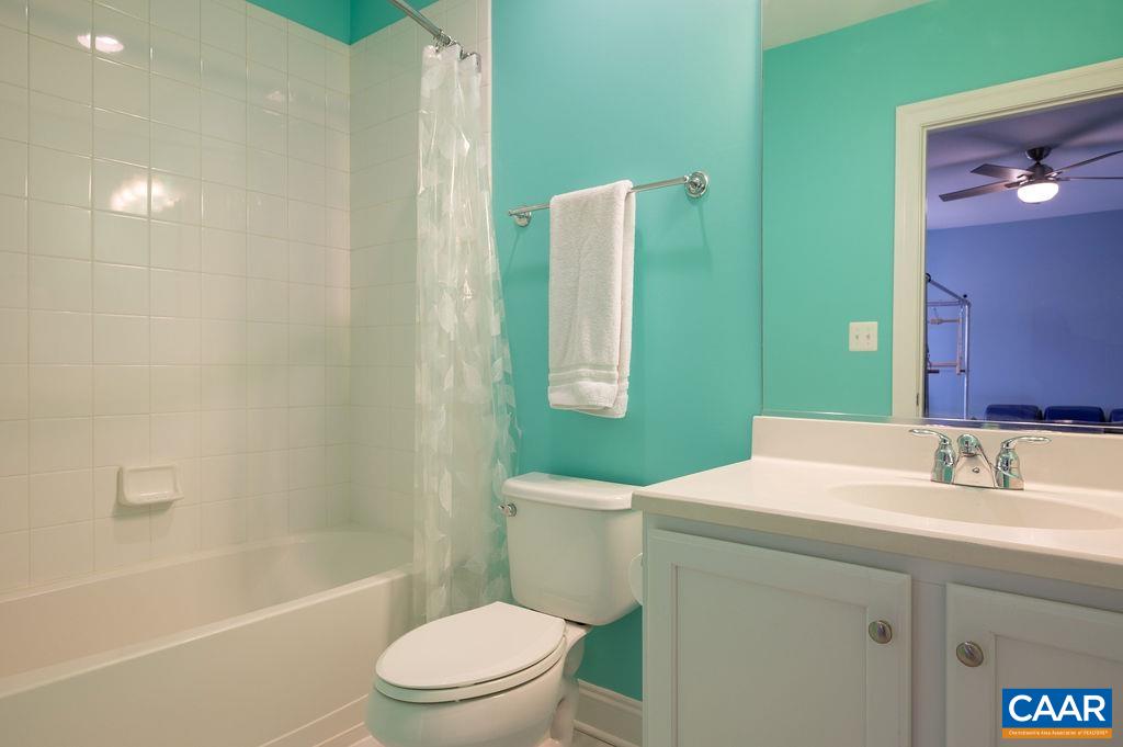 2146 Avinity Loop Charlottesville, VA 22902 - Photo 18 of 27 a bathroom with a sink a toilet and shower