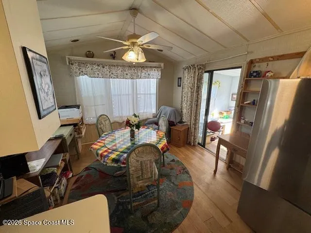 a view of a livingroom with furniture and a window