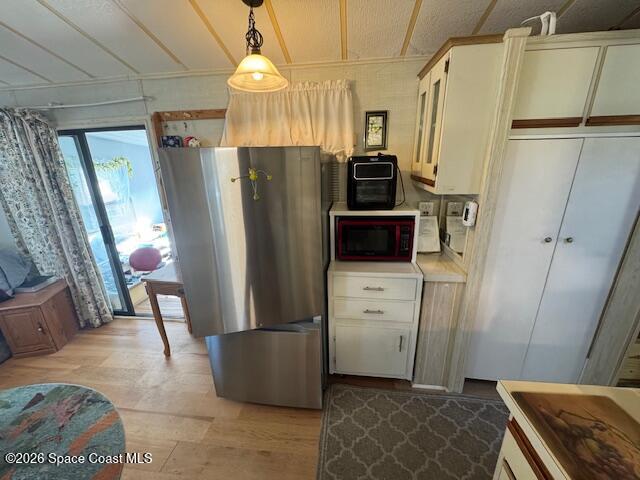 320 Akron Way Rockledge, FL 32955 - Photo 3 of 22 a kitchen with stainless steel appliances a refrigerator and a stove