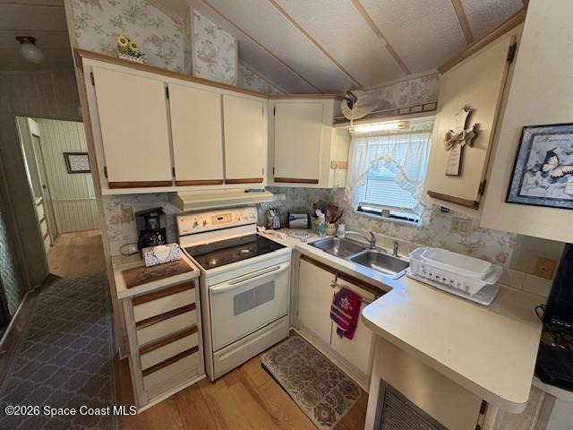 320 Akron Way Rockledge, FL 32955 - Photo 5 of 22 a kitchen with stainless steel appliances a stove a sink and a refrigerator