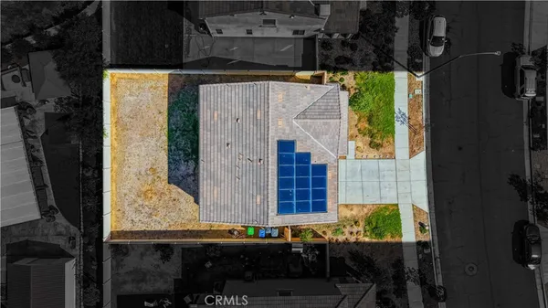 a aerial view of a house with swimming pool