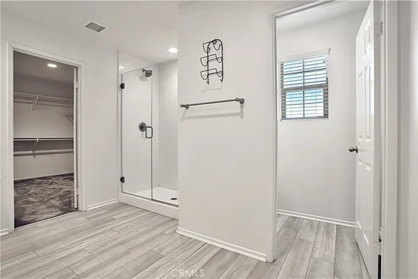 a bathroom with a double vanity sink and mirror