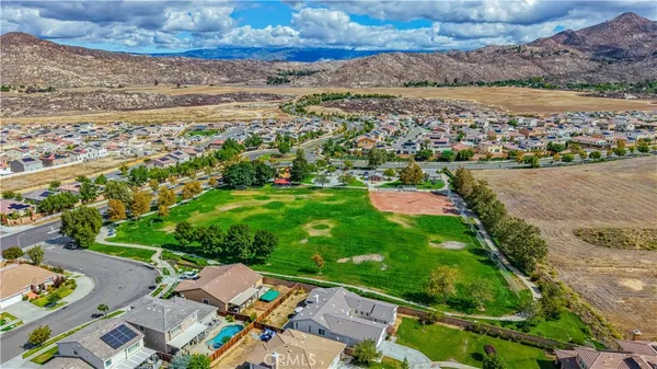 a view of swimming pool with outdoor seating and yard