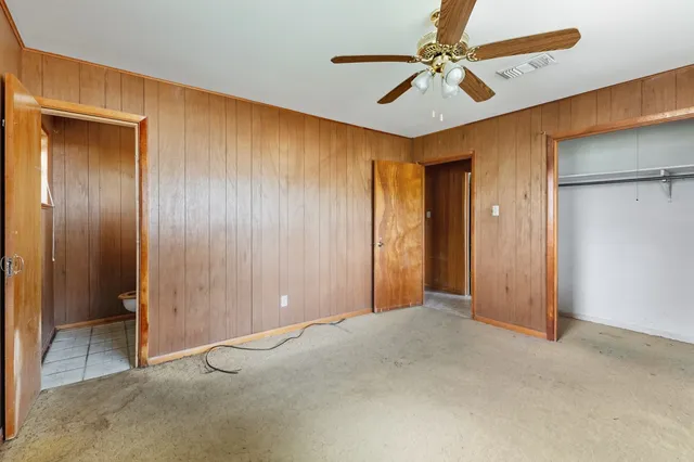 a bathroom with a sink a toilet a mirror and shower curtain