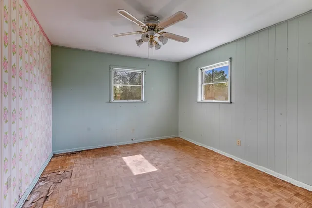 a view of an empty room with a chandelier