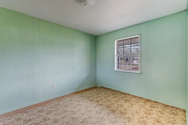 a view of a backyard of the house