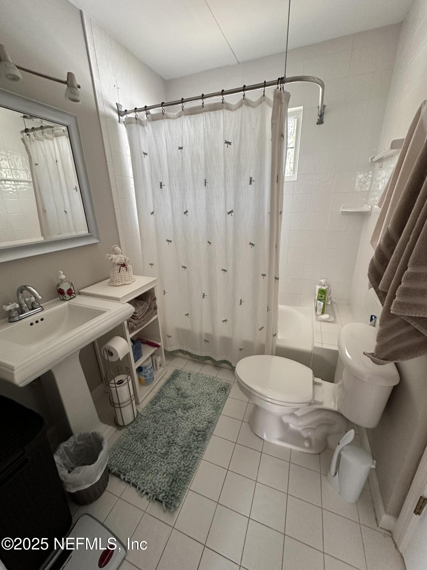 310 7th Street Atlantic Beach, FL 32233 - Photo 11 of 16 a bathroom with a sink toilet and shower