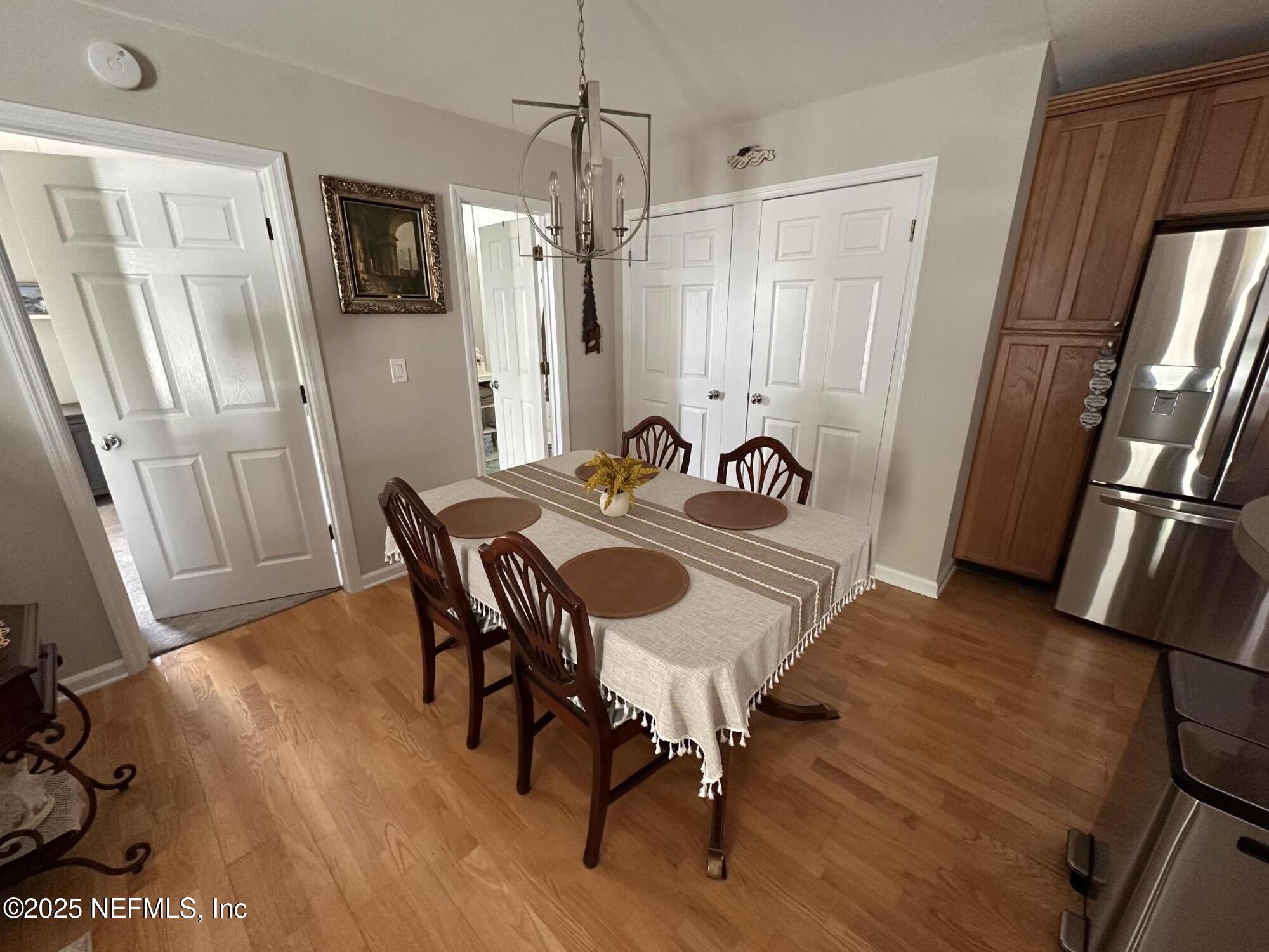 310 7th Street Atlantic Beach, FL 32233 - Photo 6 of 16 a view of a dining room with furniture window and wooden floor