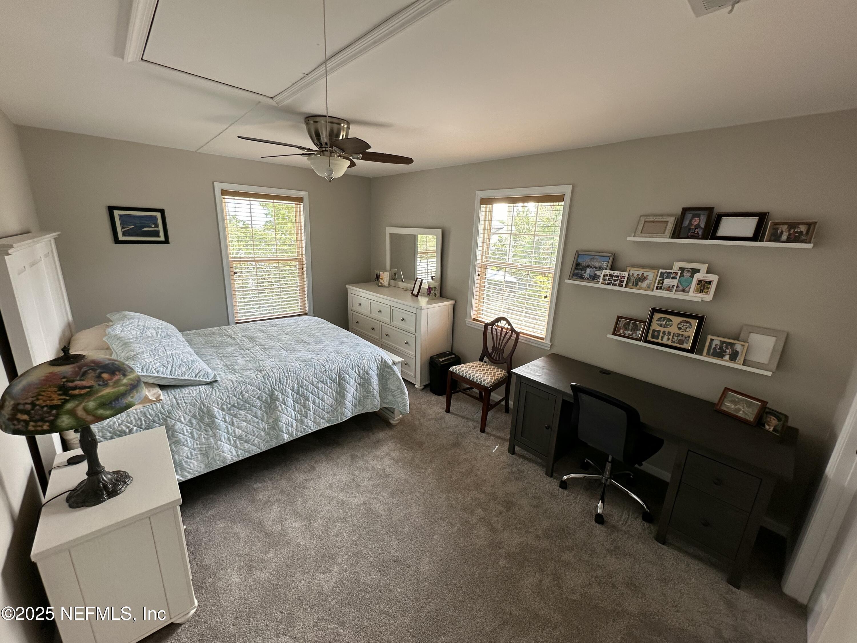 310 7th Street Atlantic Beach, FL 32233 - Photo 10 of 16 a bedroom with a bed and a window