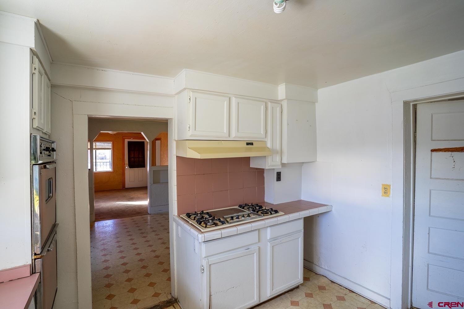120 Browning Avenue Ignacio, CO 81137 - Photo 16 of 36 a kitchen with a stove and a view of living room