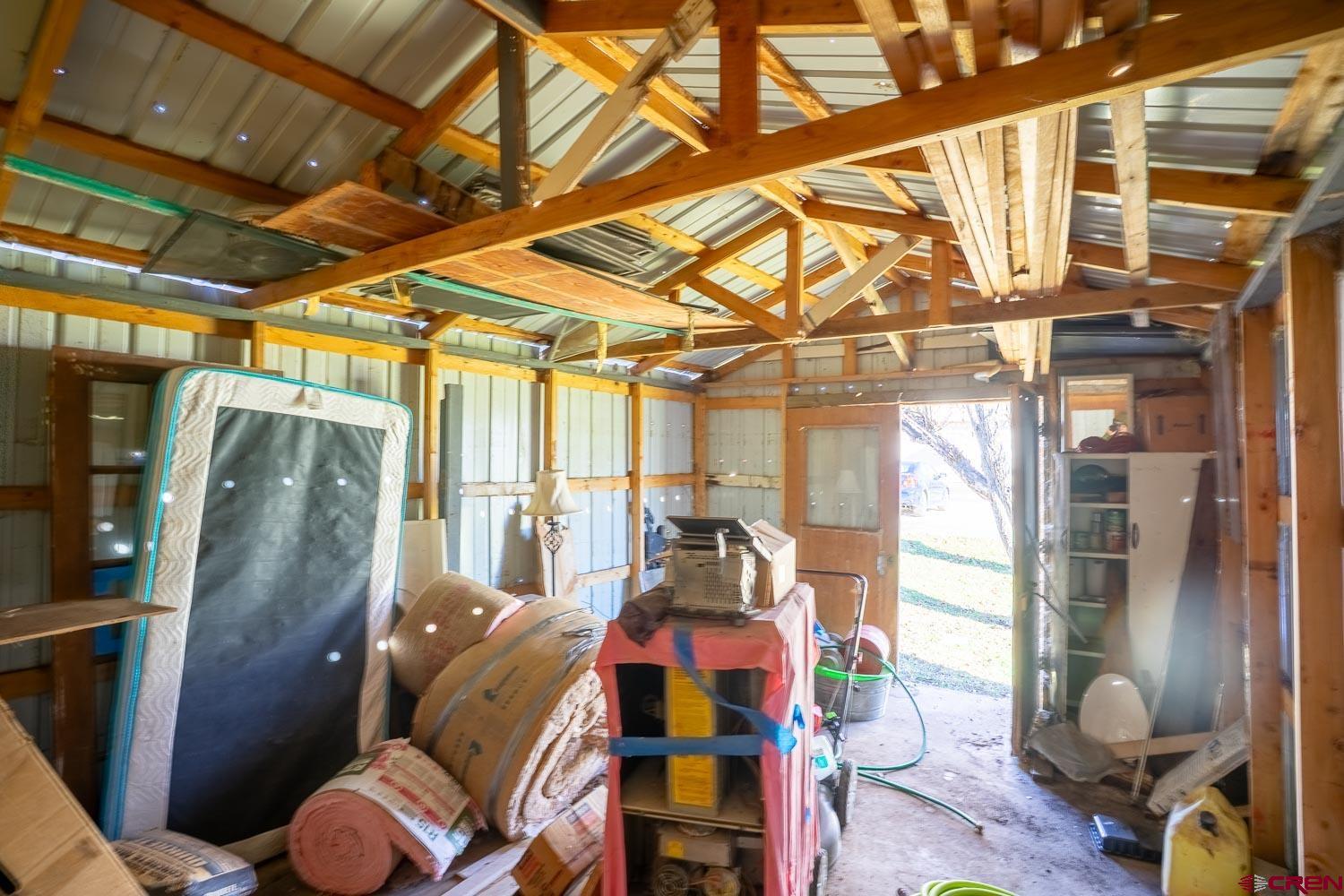 120 Browning Avenue Ignacio, CO 81137 - Photo 26 of 36 a living room with furniture and a floor to ceiling window