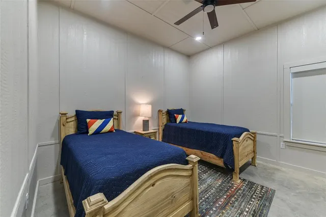 a bedroom with a bed and a rug