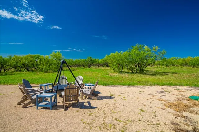 a view of a table and chairs in the patio