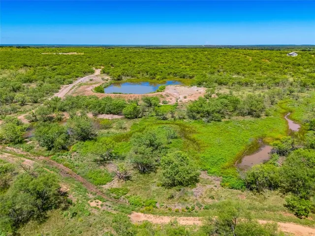 a view of an ocean and a yard
