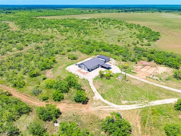 a view of a lake with a yard