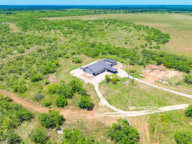a view of a lake with a yard