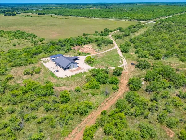a view of a lake with a yard