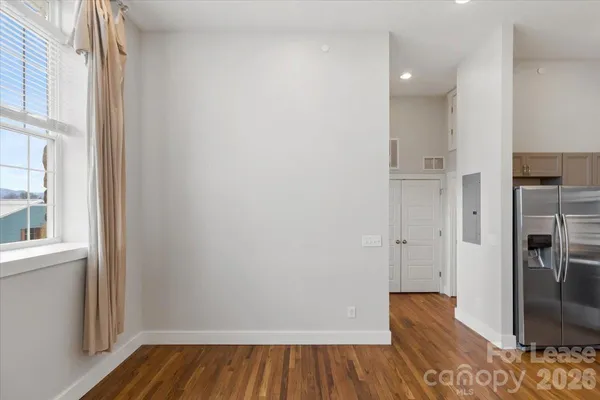 a kitchen with kitchen island a sink and a refrigerator