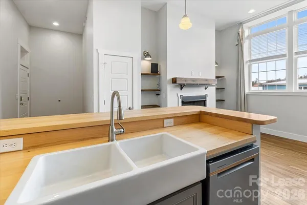a kitchen with stainless steel appliances granite countertop a stove a microwave and a refrigerator