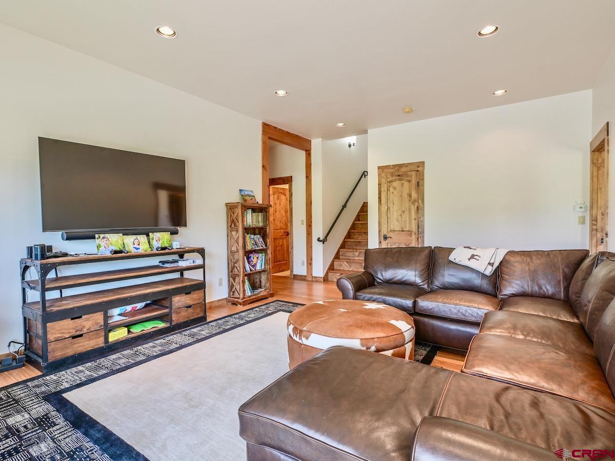 930 Gothic Road Crested Butte, CO 81225 - Photo 13 of 35 a living room with furniture and a flat screen tv