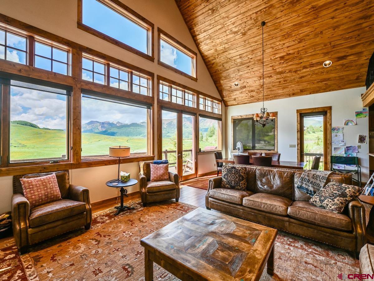 930 Gothic Road Crested Butte, CO 81225 - Photo 3 of 35 a living room with furniture and a large window